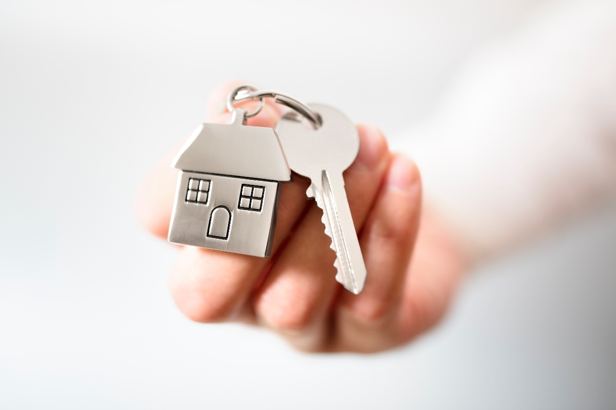Person holding a home key
